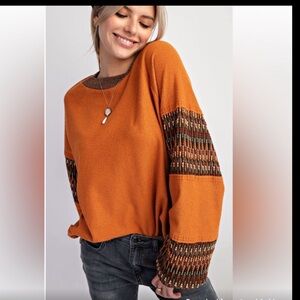 Easel ethnic trim featured insude out knot pullover NWT